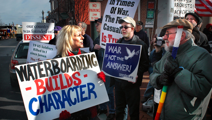 A pro-war demonstrator, left, confronts the peace movement in West Chester, PA. Photo by John Grant